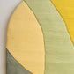 Green & yellow irregular hand tufted carpet & rug